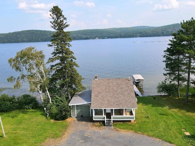 drone / aerial view with a water view