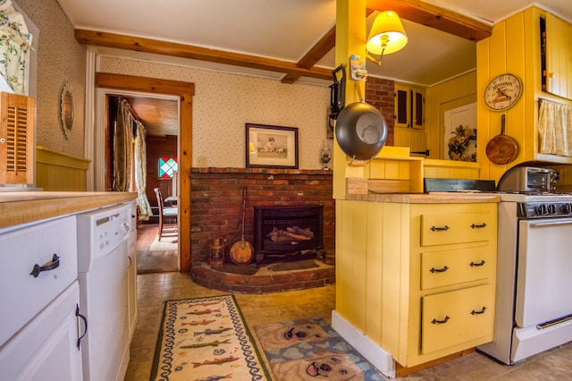 kitchen with a fireplace, light hardwood / wood-style flooring, and white appliances