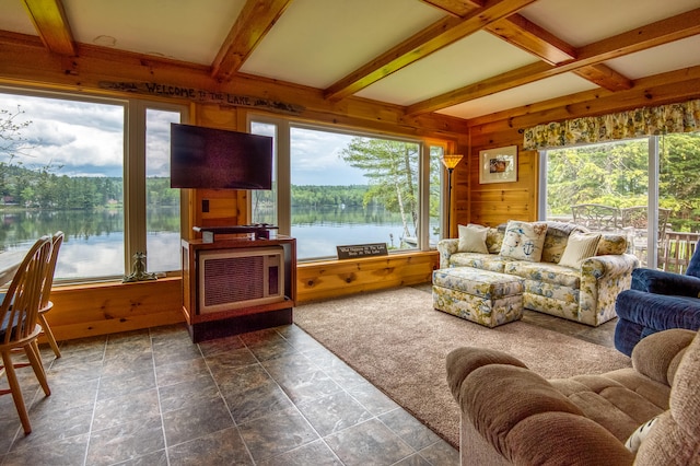 living room featuring dark tile patterned floors, beamed ceiling, and coffered ceiling