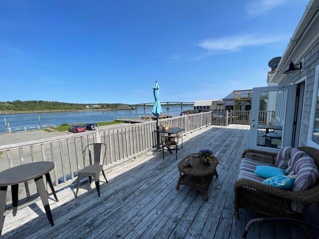 wooden terrace with a water view