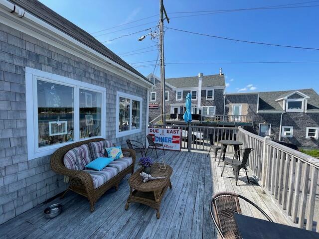 wooden deck featuring an outdoor living space