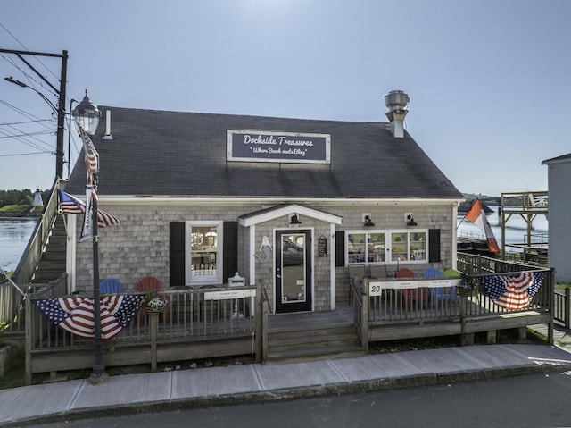 20 Water St Unit 2, Lubec, ME 04652 - view of front of home with a wooden deck and a shingled roof