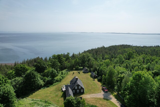 38 Kingsbury Ln, Perry, ME 04667 - aerial view of property and surrounding area with a heavily wooded area and a large body of water