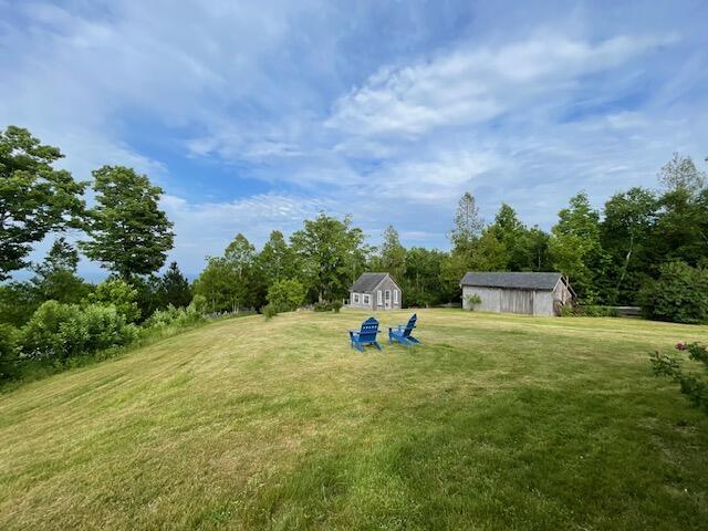 38 Kingsbury Ln, Perry, ME 04667 - view of green lawn with a storage unit