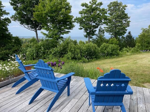 38 Kingsbury Ln, Perry, ME 04667 - wooden terrace with a lawn