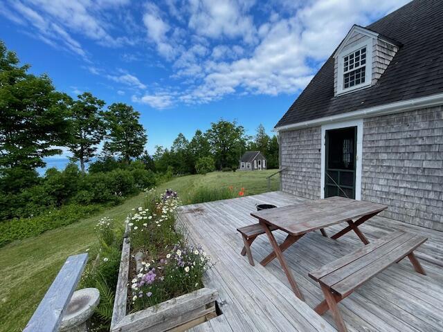 38 Kingsbury Ln, Perry, ME 04667 - wooden terrace with a yard and outdoor dining area