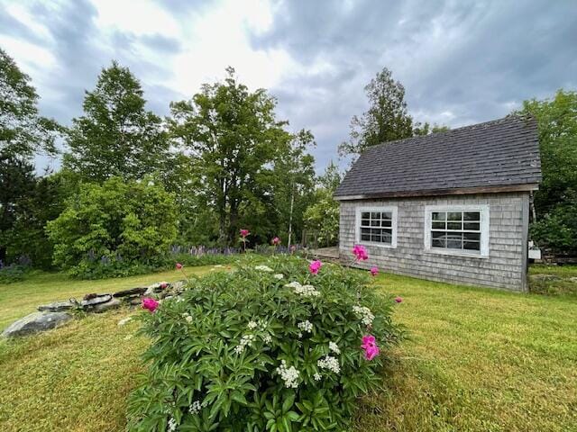 38 Kingsbury Ln, Perry, ME 04667 - view of grassy yard with an outdoor structure