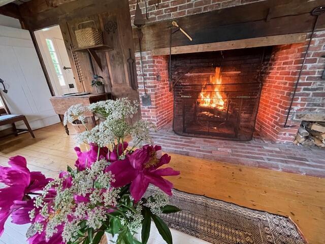 38 Kingsbury Ln, Perry, ME 04667 - detailed view of wood finished floors and a fireplace