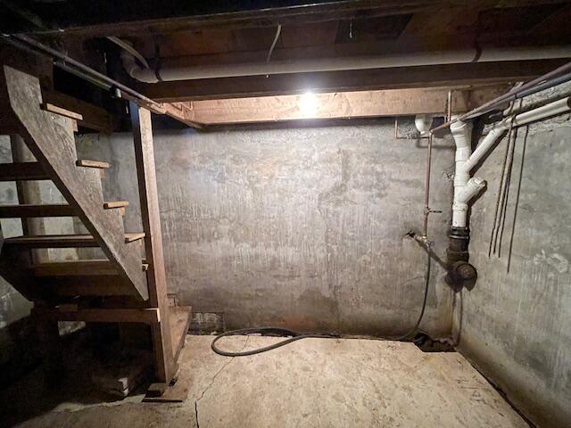 38 Kingsbury Ln, Perry, ME 04667 - unfinished below grade area featuring stairway