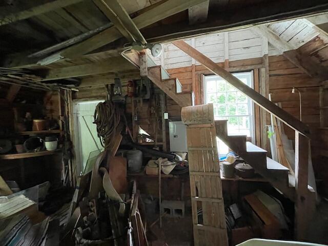 38 Kingsbury Ln, Perry, ME 04667 - misc room featuring wooden walls, stairway, and vaulted ceiling