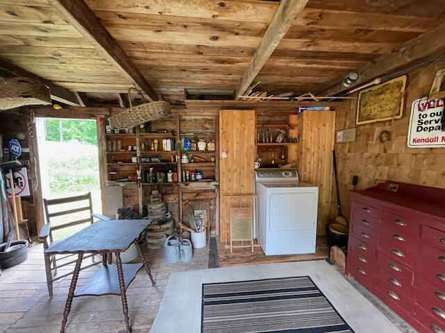 38 Kingsbury Ln, Perry, ME 04667 - laundry room featuring washer / clothes dryer, wood ceiling, and wooden walls