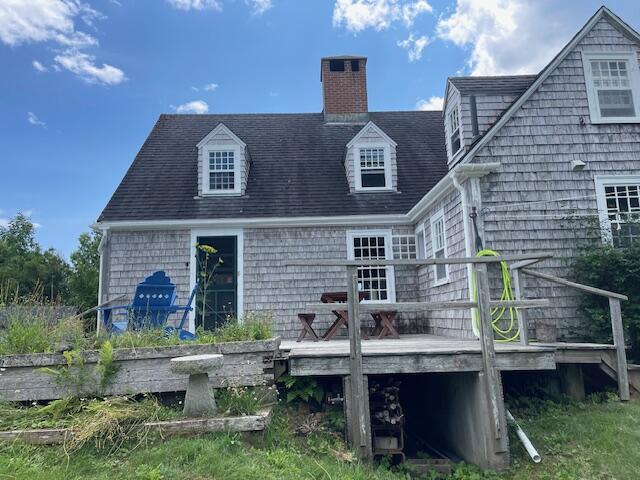 38 Kingsbury Ln, Perry, ME 04667 - rear view of house with a deck and a chimney