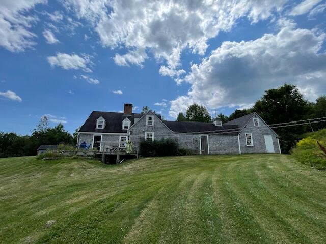 38 Kingsbury Ln, Perry, ME 04667 - back of house with a lawn and a chimney