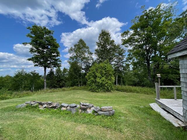 38 Kingsbury Ln, Perry, ME 04667 - view of grassy yard with a deck