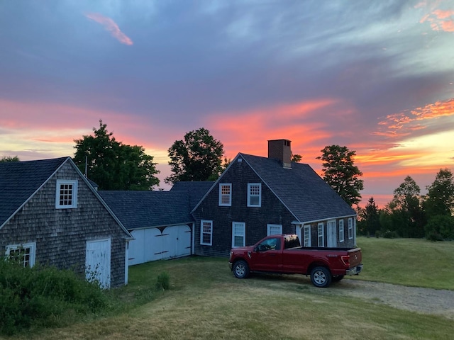 38 Kingsbury Ln, Perry, ME 04667 - view of front of house featuring a chimney, a yard, and a shingled roof
