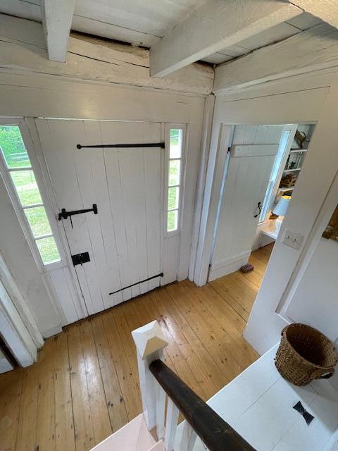 38 Kingsbury Ln, Perry, ME 04667 - foyer entrance featuring light wood-type flooring and beam ceiling
