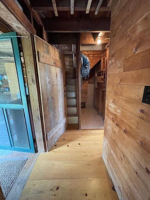 38 Kingsbury Ln, Perry, ME 04667 - corridor featuring wooden walls and light wood-style flooring