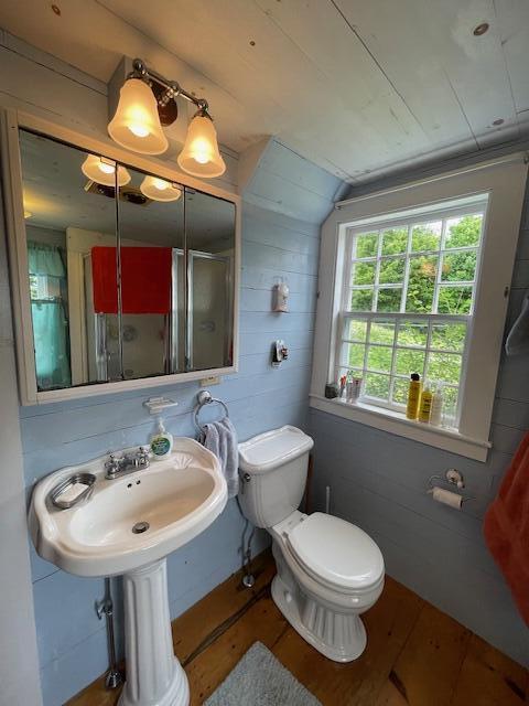 38 Kingsbury Ln, Perry, ME 04667 - full bath with wood finished floors, lofted ceiling, and an enclosed shower