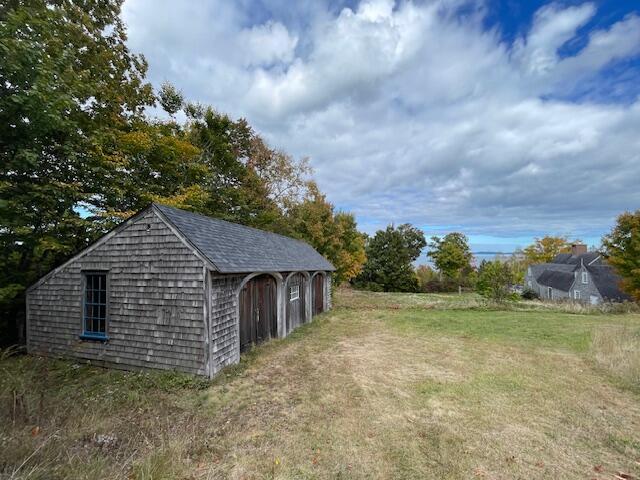 38 Kingsbury Ln, Perry, ME 04667 - view of grassy yard with an outdoor structure