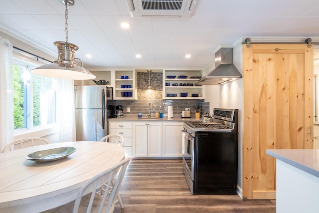 kitchen featuring white cabinetry, backsplash, stainless steel appliances, wall chimney exhaust hood, and sink