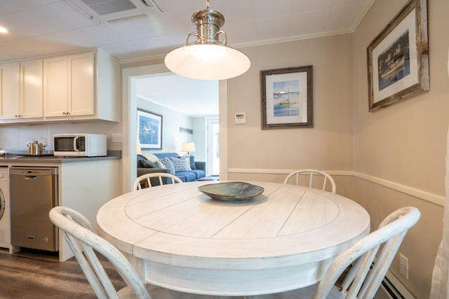 dining space with ornamental molding and dark wood-type flooring