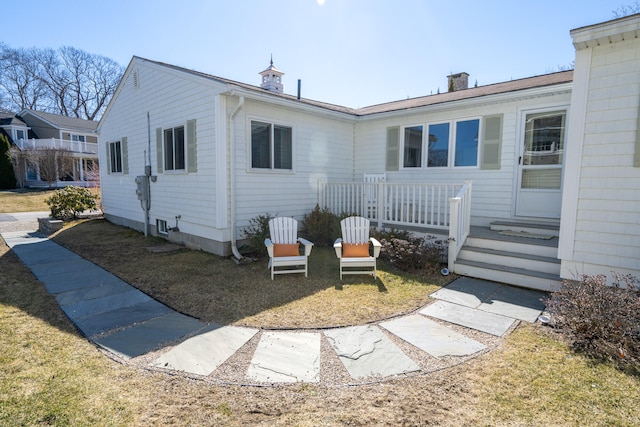 back of house with a yard