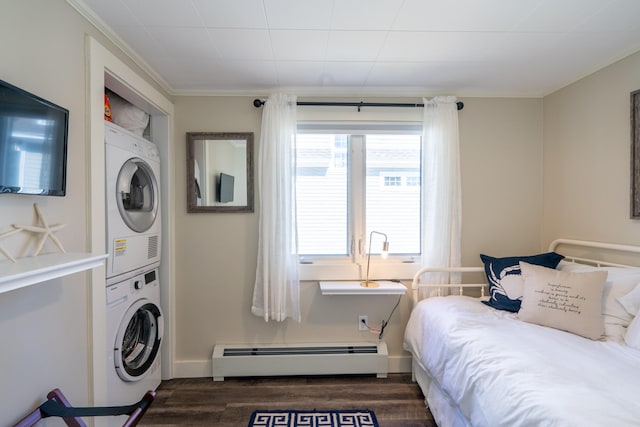 interior space featuring crown molding, dark hardwood / wood-style flooring, a baseboard heating unit, and stacked washer / drying machine