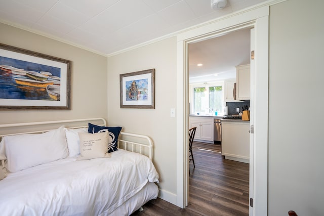 bedroom featuring dark wood-type flooring and crown molding