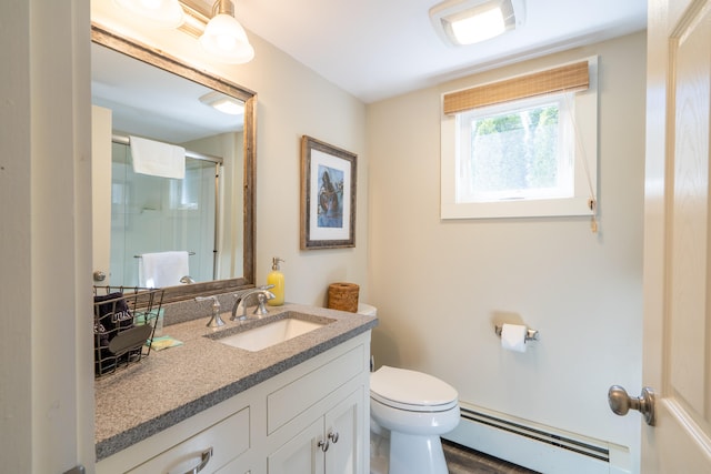 bathroom with vanity, a baseboard radiator, and toilet