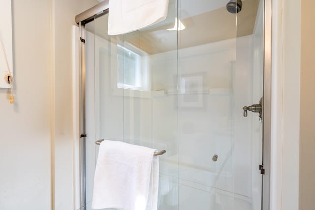 bathroom featuring an enclosed shower