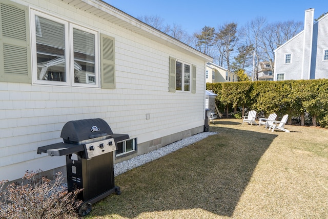 view of property exterior with a yard