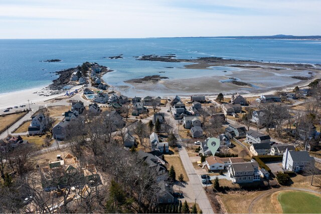 drone / aerial view featuring a view of the beach and a water view