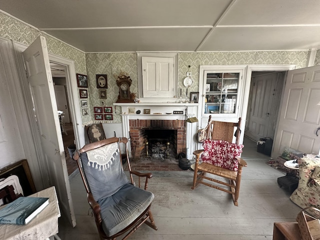 living area with hardwood / wood-style floors and a fireplace