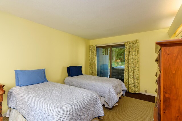 carpeted bedroom featuring access to exterior