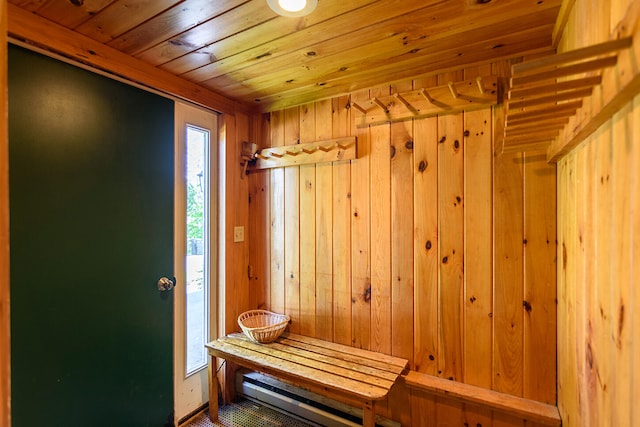 mudroom with wood walls and wood ceiling