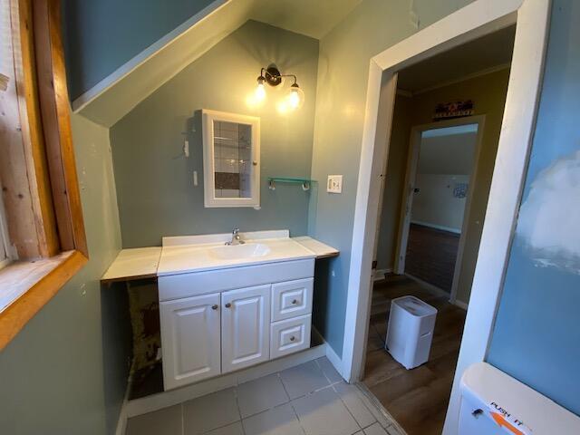 bathroom with vanity, tile patterned flooring, and toilet