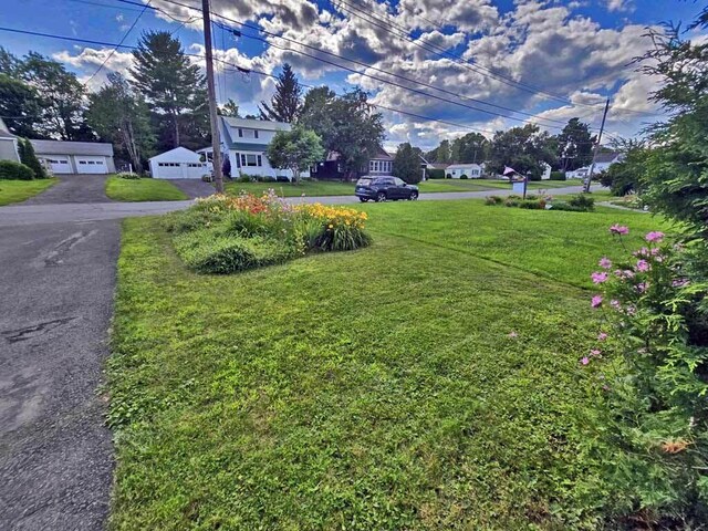 view of yard featuring a garage