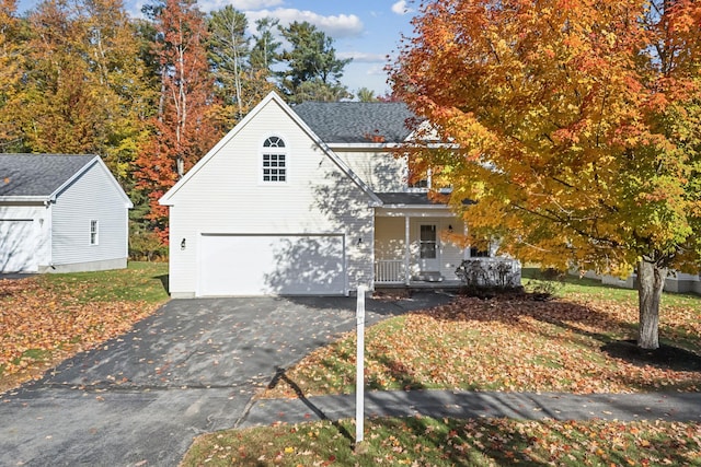 view of front of house featuring covered porch and a garage