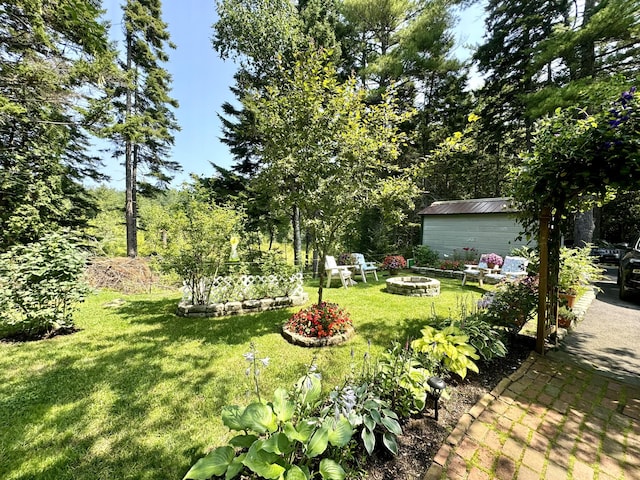 121 Northern Neck Rd, Mount Desert, ME 04660 - view of yard featuring an outdoor fire pit and an outdoor structure
