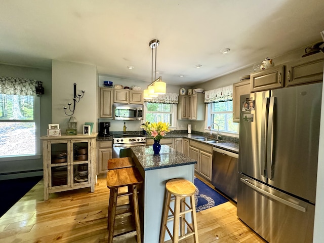 121 Northern Neck Rd, Mount Desert, ME 04660 - kitchen with light wood-style flooring, a breakfast bar, stainless steel appliances, a sink, and a center island