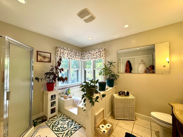 bathroom featuring vanity, an enclosed shower, tile patterned flooring, and toilet