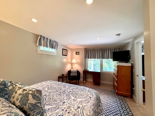 bedroom featuring light tile patterned flooring