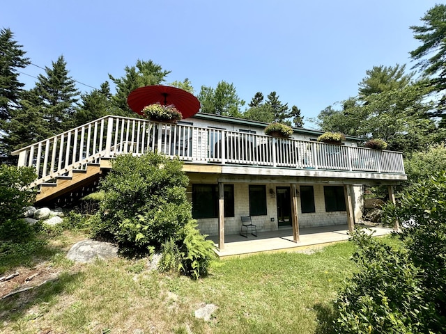 121 Northern Neck Rd, Mount Desert, ME 04660 - back of house featuring concrete block siding, a yard, a deck, and a patio