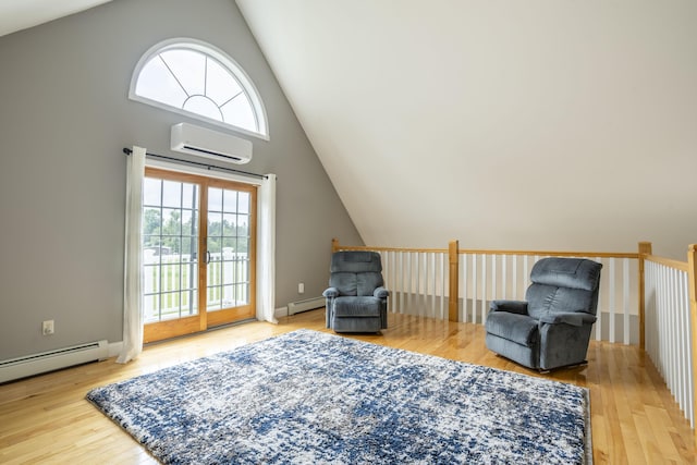 living area with a wall mounted AC, a baseboard radiator, and wood-type flooring