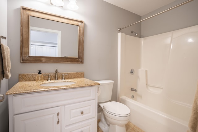 full bathroom featuring washtub / shower combination, toilet, and vanity