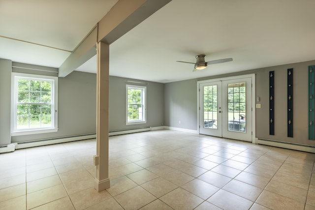 tiled empty room featuring ceiling fan, french doors, and a baseboard radiator