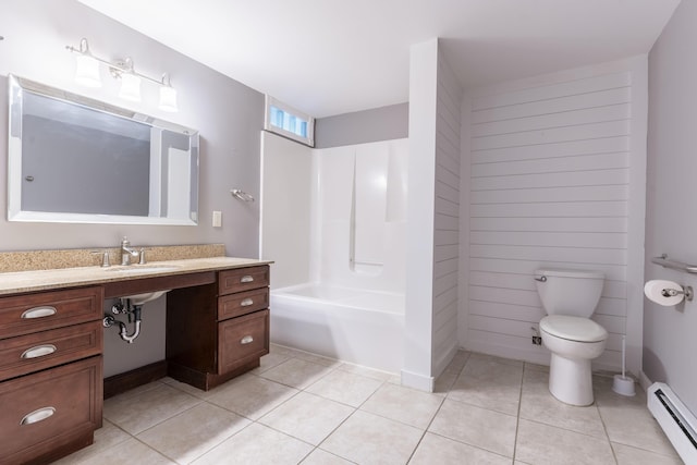 full bathroom featuring tile patterned flooring, a baseboard heating unit, toilet, sink, and shower / bath combination