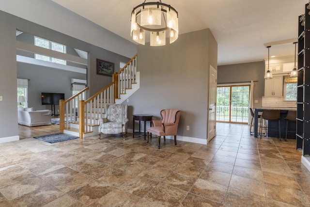 entrance foyer featuring a towering ceiling