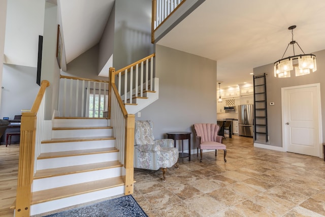 staircase featuring a high ceiling