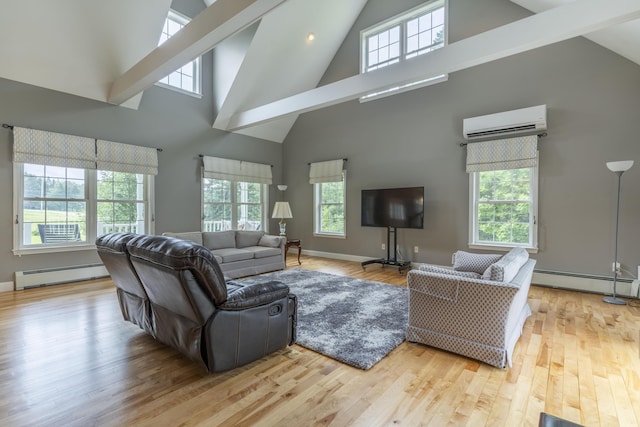 living room featuring baseboard heating, light hardwood / wood-style flooring, and a wall mounted AC